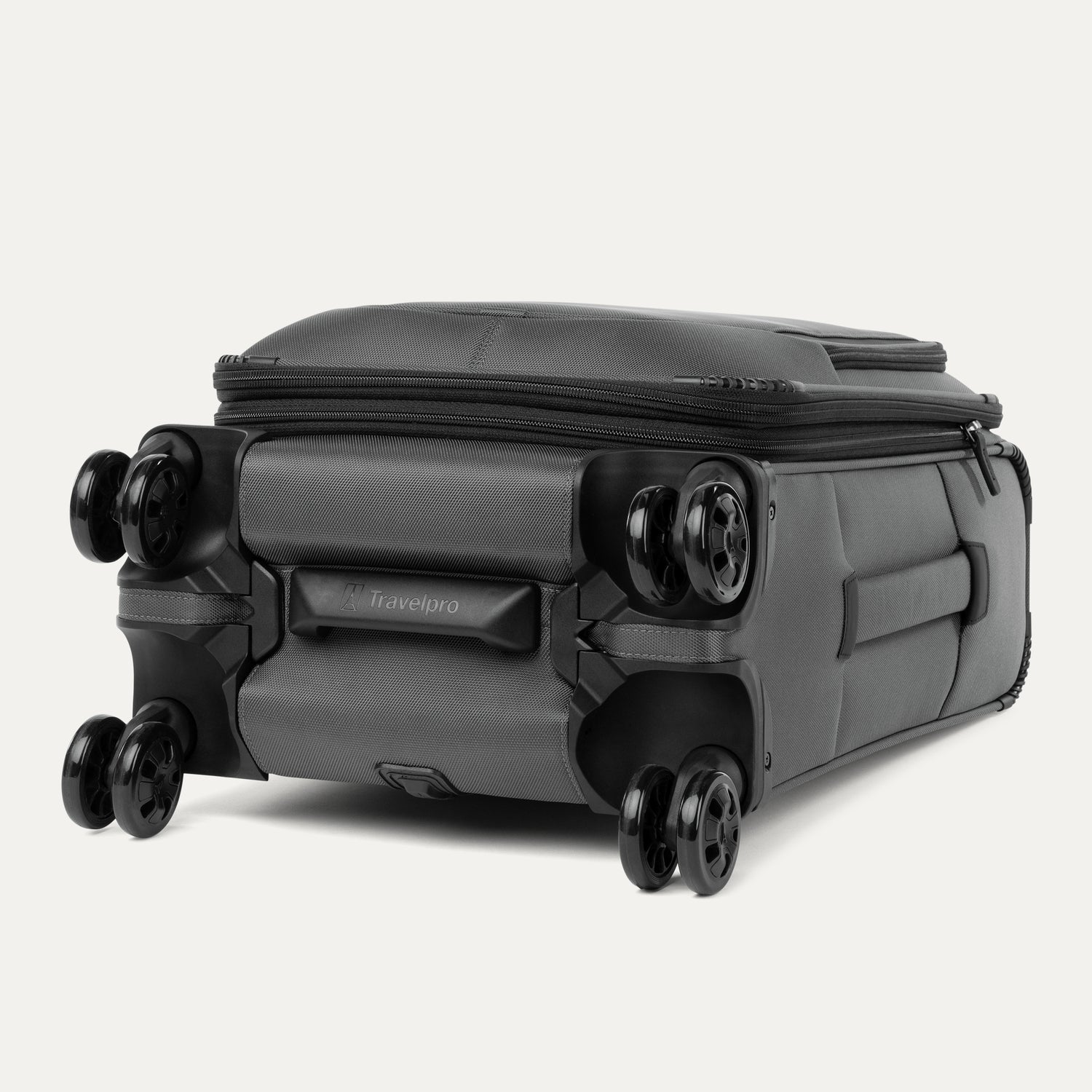 Gray suitcase with black wheels on a white background