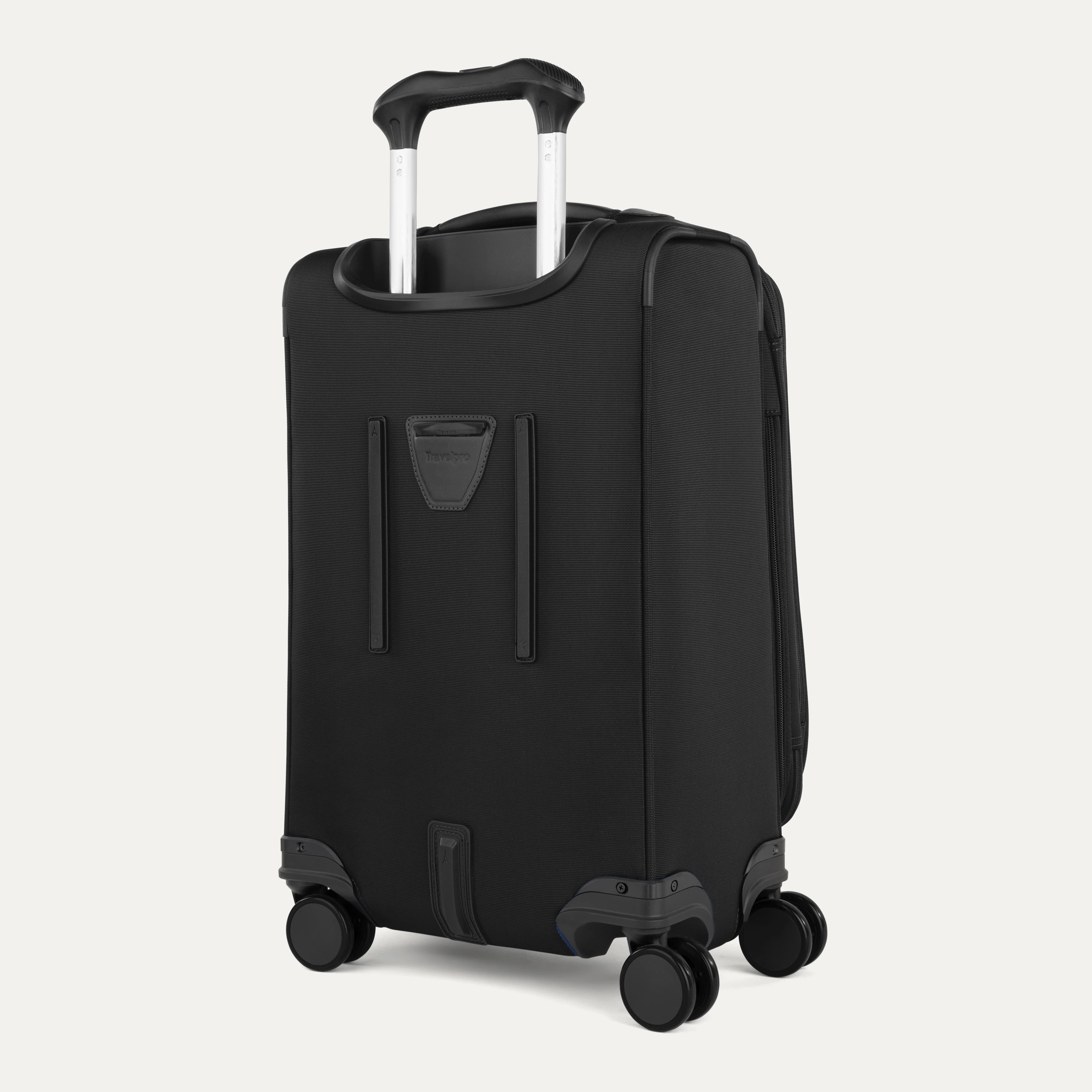 Rear view of the Travelpro Versapack Expandable Spinner in Black, featuring a PowerScope Extension Handle and built-in bottom handle.