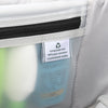 Interior lining tag on a Travelpro suitcase, highlighting construction from 100% post-consumer recycled plastic bottles.