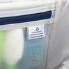 Interior lining tag on a Travelpro suitcase, highlighting construction from 100% post-consumer recycled plastic bottles.