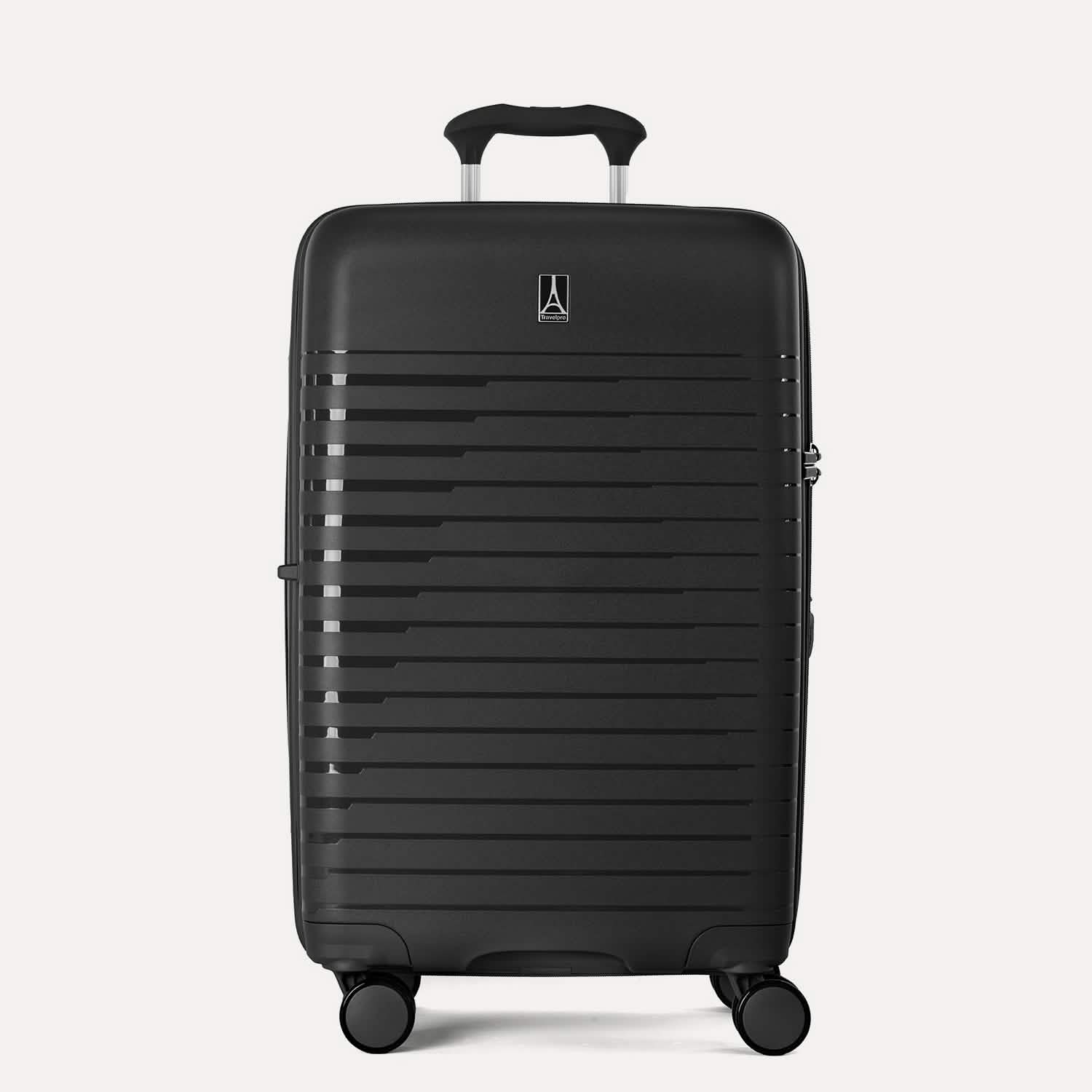 Valise noire avec le logo de la marque bien visible sur un fond gris clair