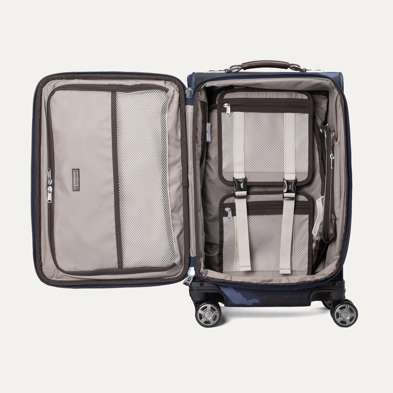 Interior view of the Travelpro Platinum Elite Carry-On Spinner in Camouflage, featuring mesh compartments and adjustable compression straps.