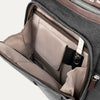 Open front compartment of a grey backpack on a white background.