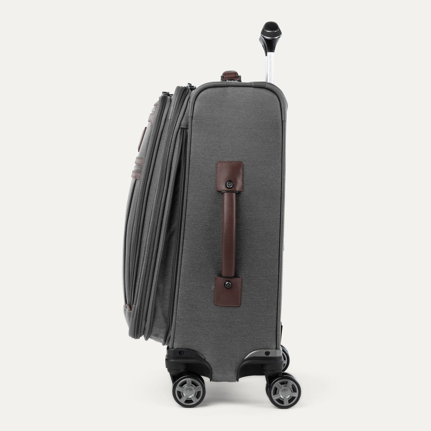 Side view of gray suitcase with black wheels and handle on a white background