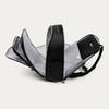 Black backpack with all the compartments open on a white background
