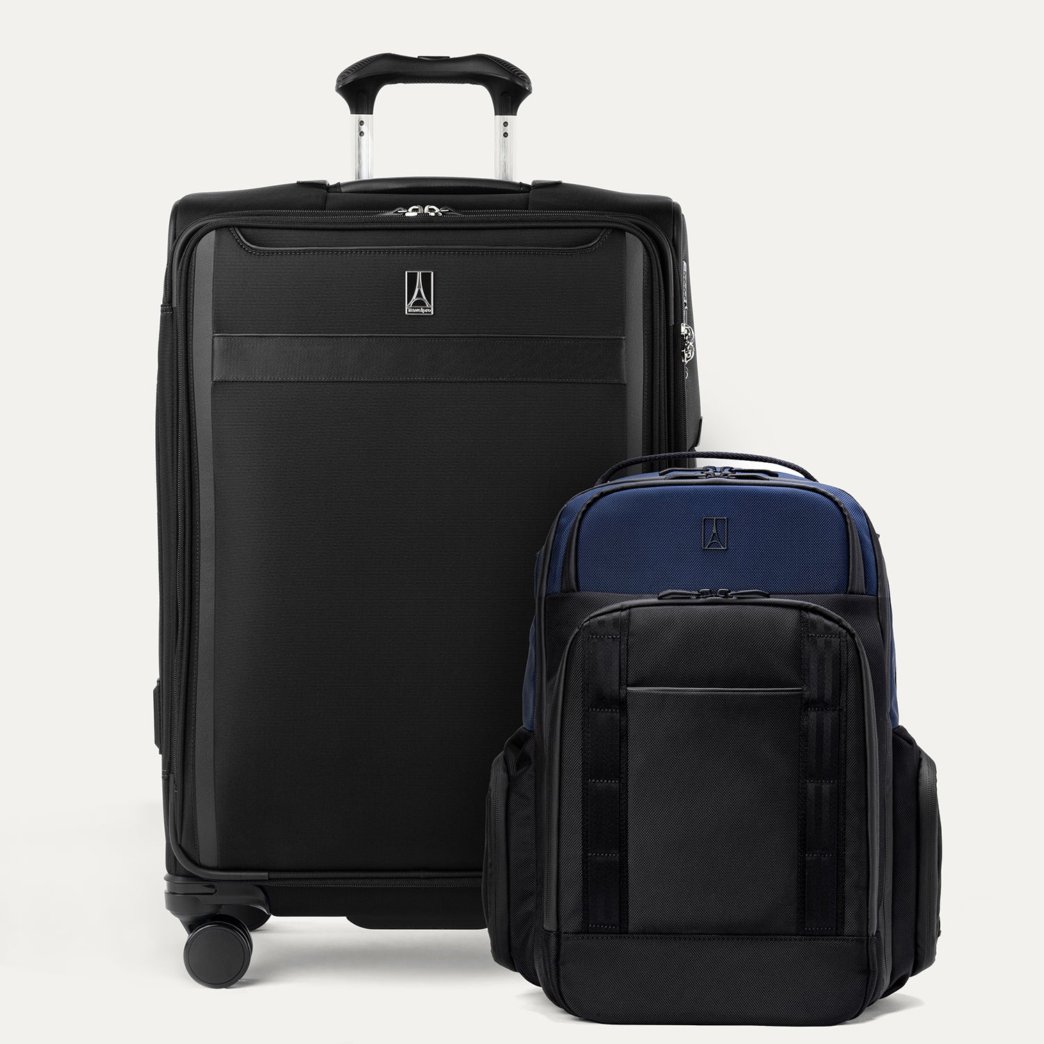 A set of two pieces of luggage, a larger check-in spinner suitcase in black and a expandable laptop backpack in aviator navy
