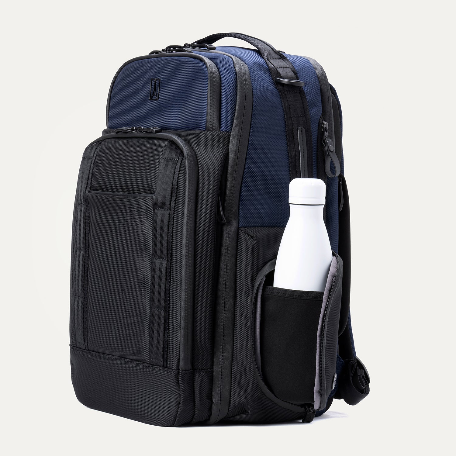 Side view of aviator navy backpack with a water bottle in the side compartment on a white background.
