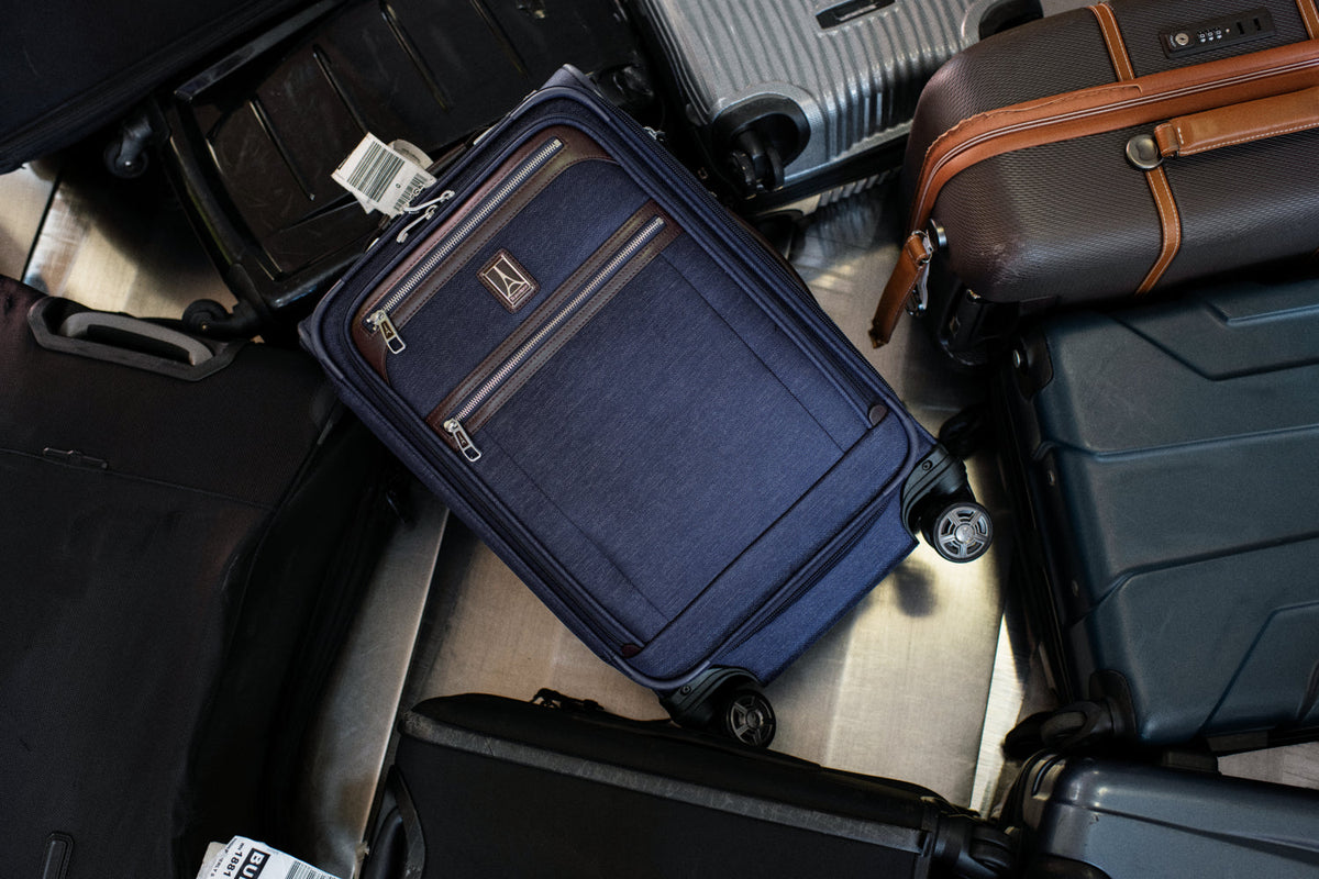 Travelpro spinner suitcase and assorted luggage