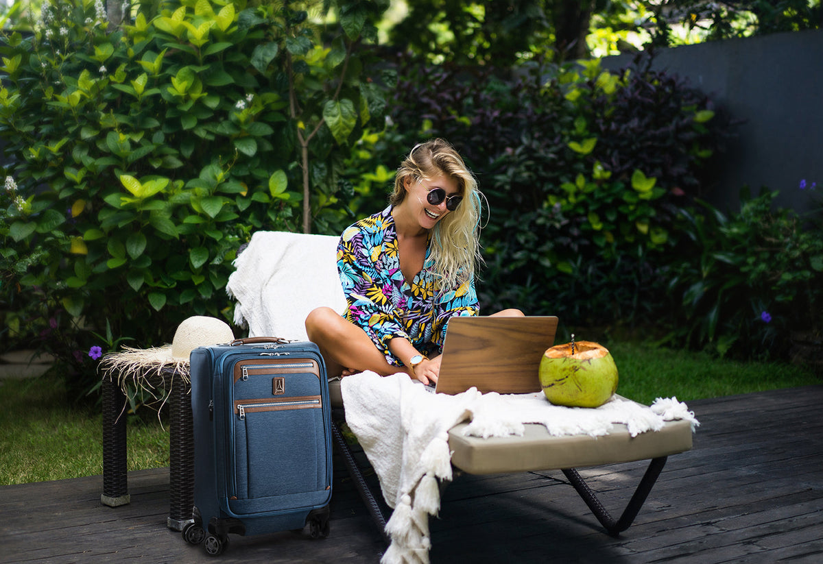 Woman working on laptop outdoors