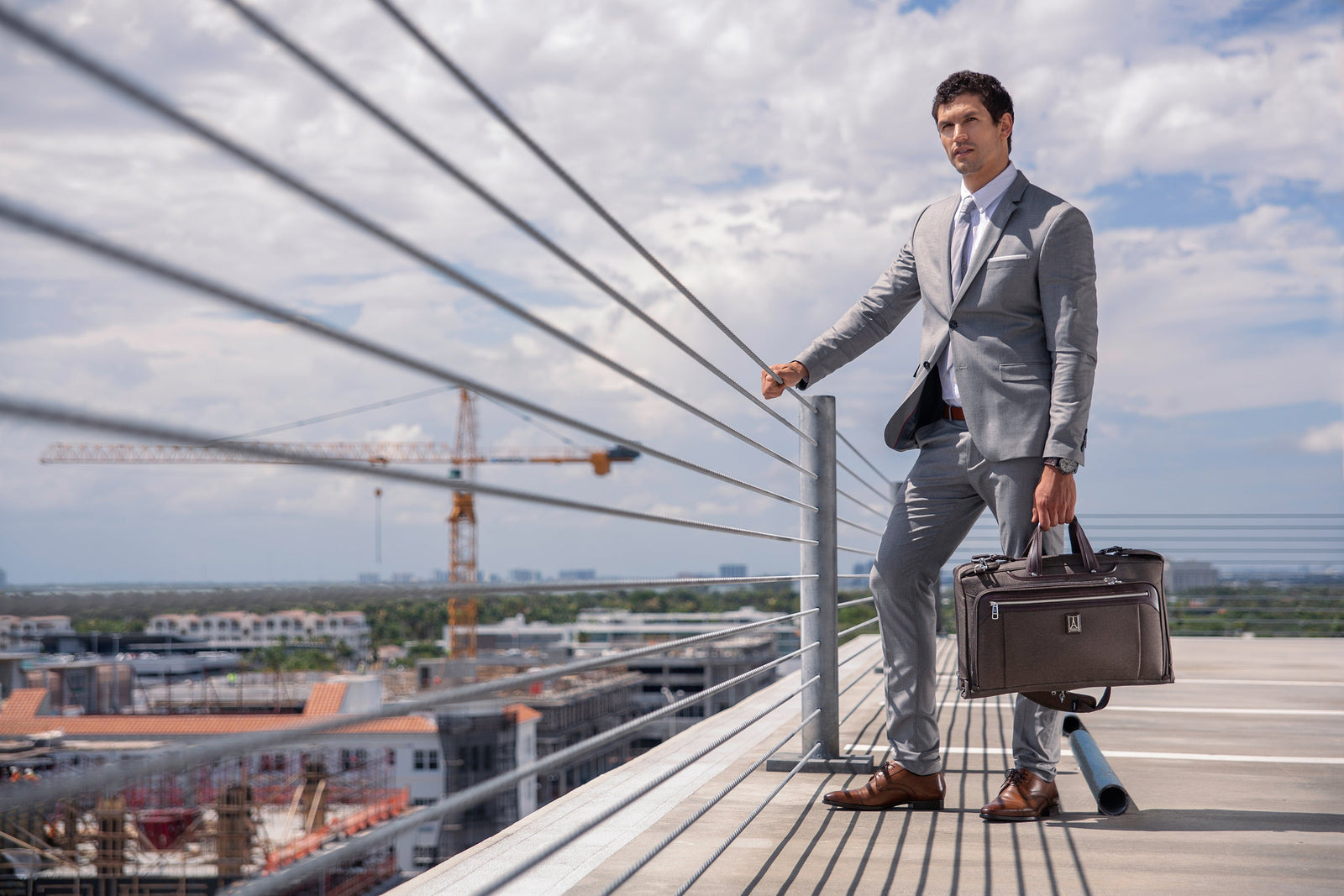 Man holding garment bag
