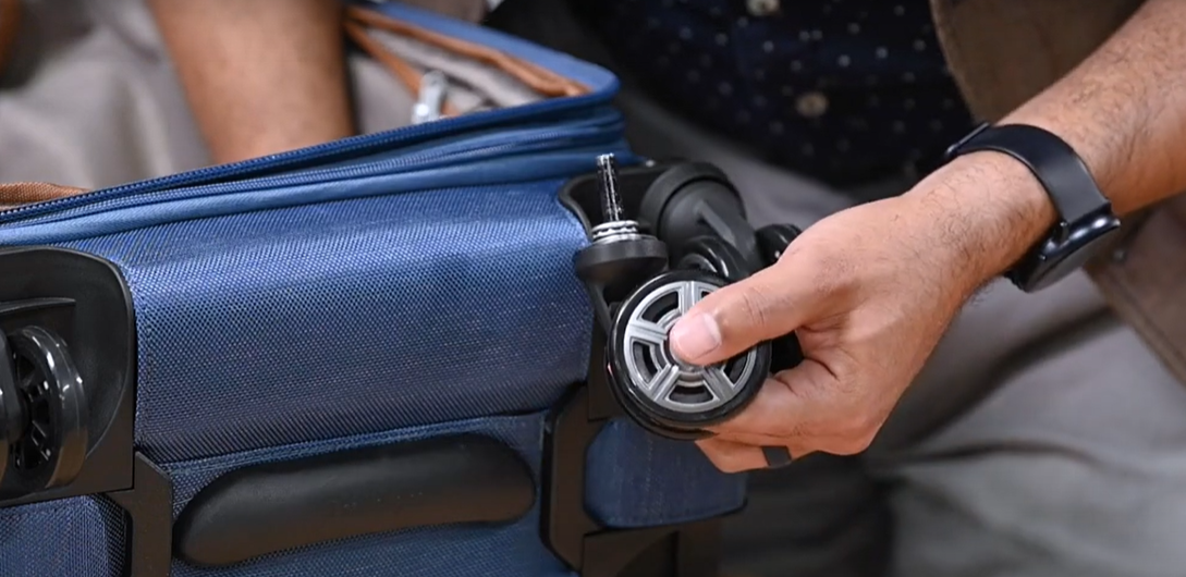 wheel of a suitcase being repaired
