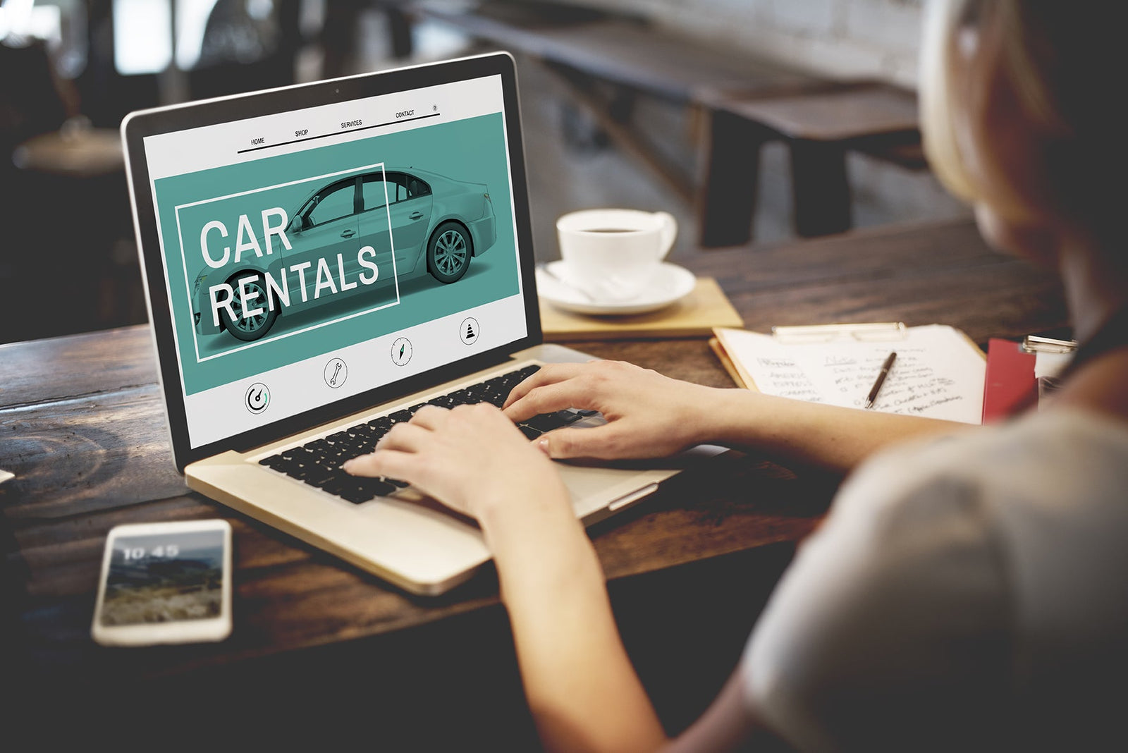 Browsing car rental website on a laptop
