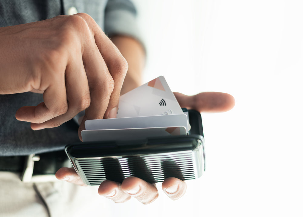 man reaching into RFID wallet