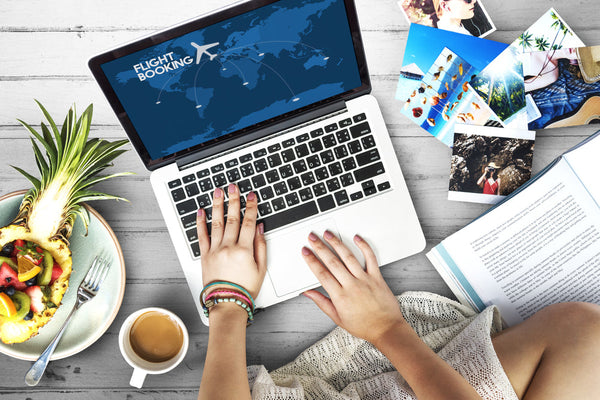 woman using laptop to book a flight.