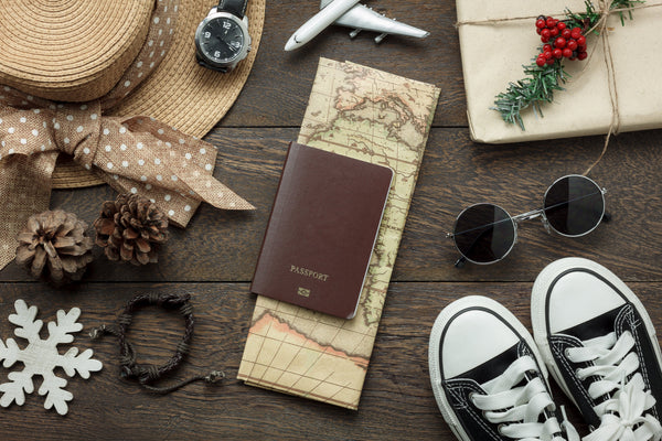 Passport and travel accessories being prepared for holiday trip