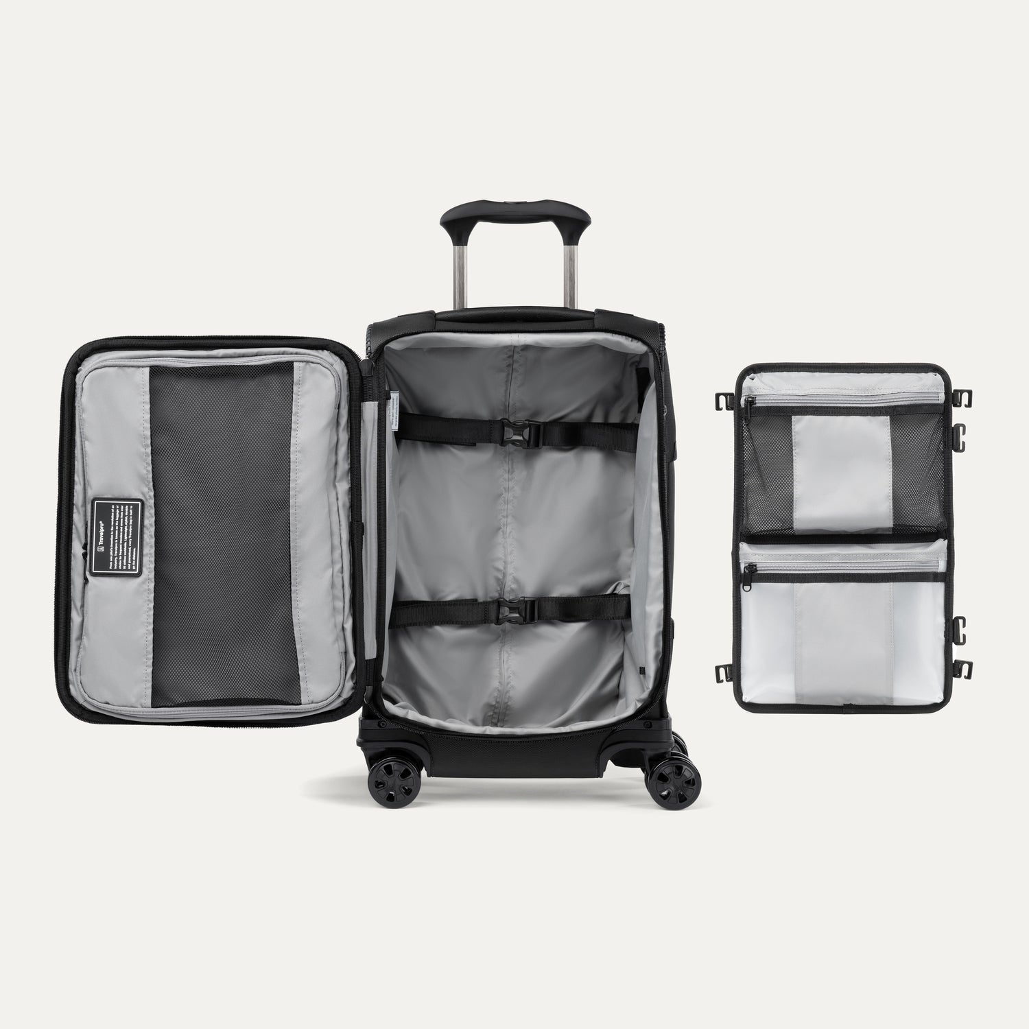 Vue intérieure de la valise à roulettes Travelpro Crew Classic en noir, montrant les poches de rangement et les sangles de maintien réglables.
