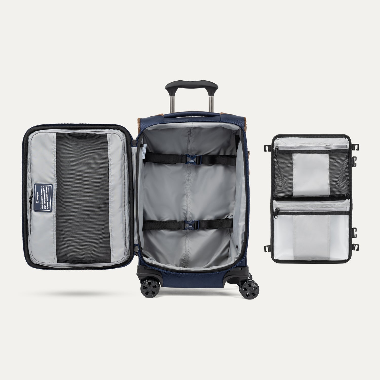 Vue intérieure de la valise à roulettes Travelpro Crew Classic Spinner, couleur Patriot Blue, montrant les pochettes de rangement et les sangles de maintien.