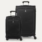 A set of two black spinner suitcases, one carry-on size and one check-in size on a white background 