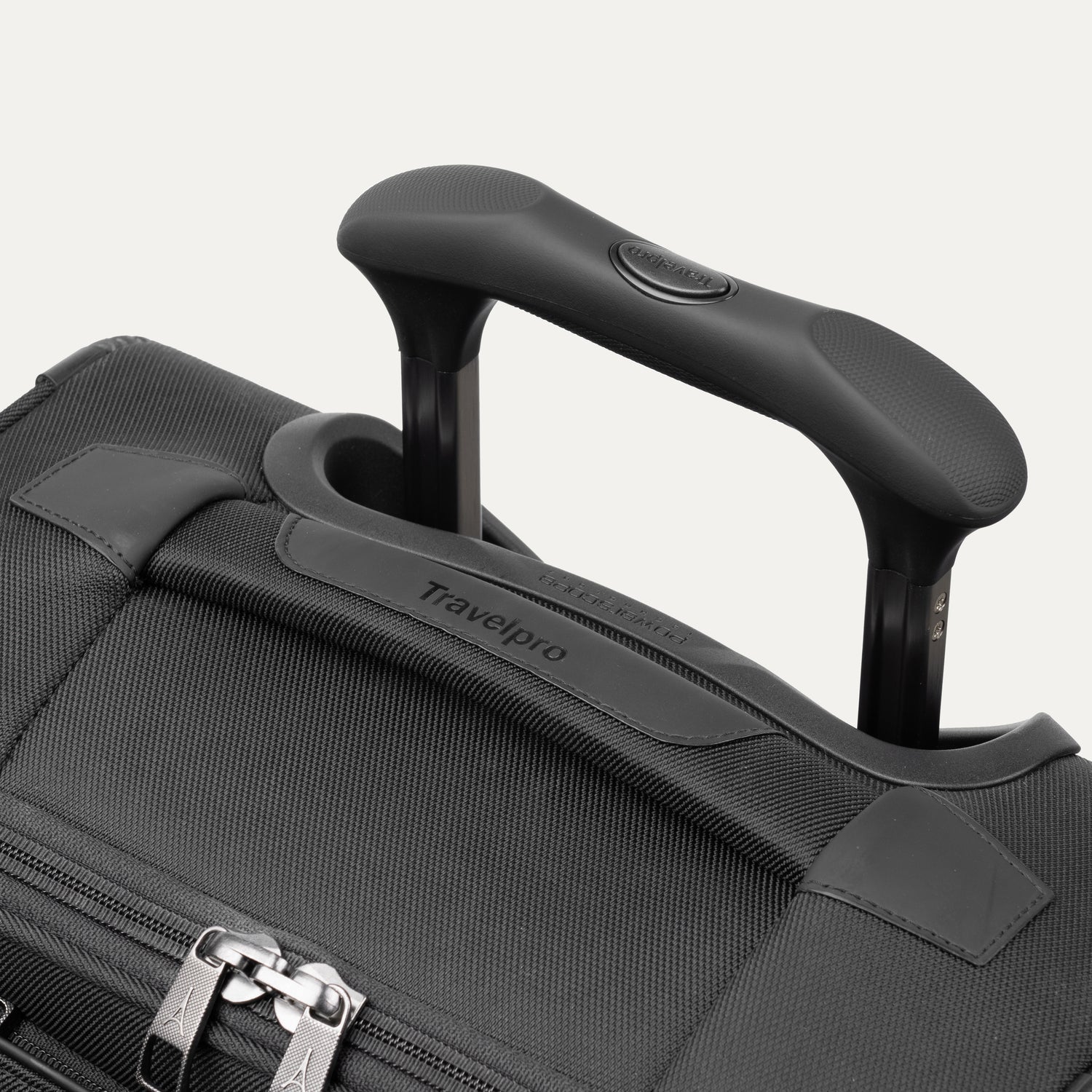 Close-up of a black suitcase handle 