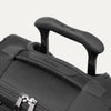 Close-up of a black suitcase handle 