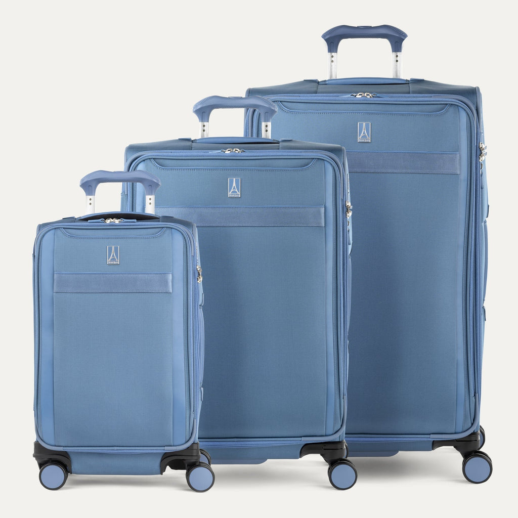 Travelpro Versapack Spinner set in Elemental Blue, shown in Carry-On, Medium, and Large Checked sizes with smooth 360° Spinner Wheels.
