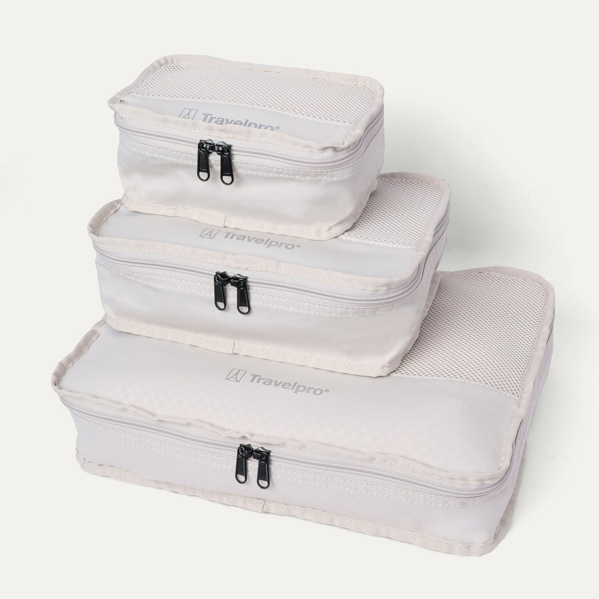 Packing cubes included with the Travelpro Platinum Reserve Compact Carry-On Hardside Spinner in Black Dust, stacked by size