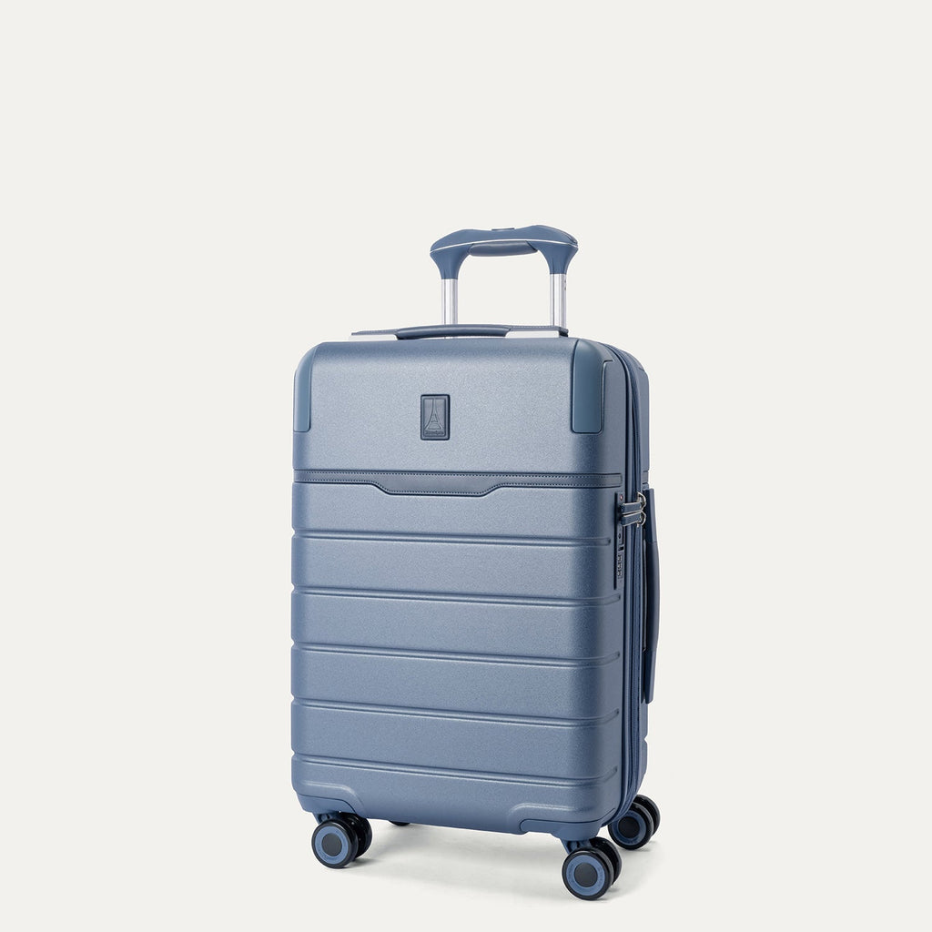 Three-quarter angled view of the Travelpro Platinum Reserve Compact Carry-On Hardside Spinner in Steel Blue