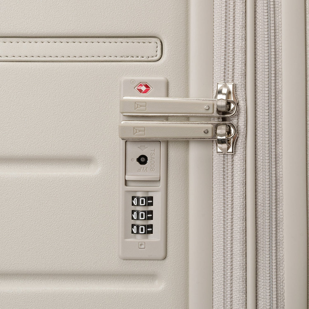Close-up of the built-in TSA lock on the Travelpro Platinum Reserve Compact Carry-On Hardside Spinner in Sandstone