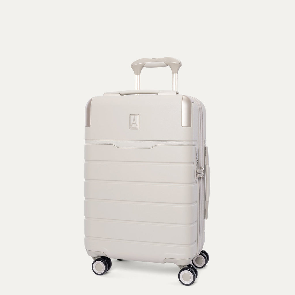 Three-quarter angled view of the Travelpro Platinum Reserve Compact Carry-On Hardside Spinner in Sandstone
