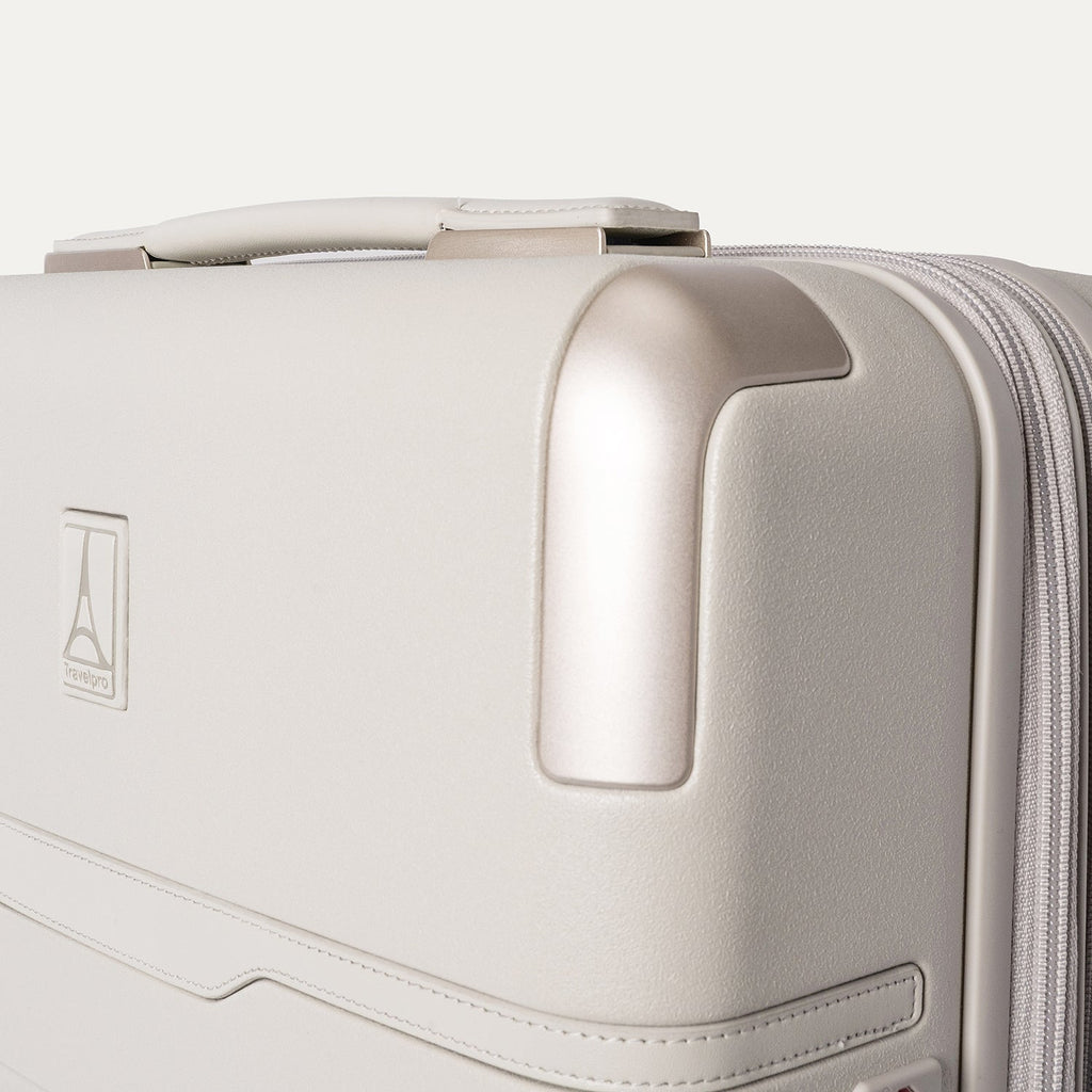 Close-up of the zinc corner armour on the Travelpro Platinum Reserve Compact Carry-On Hardside Spinner in Sandstone