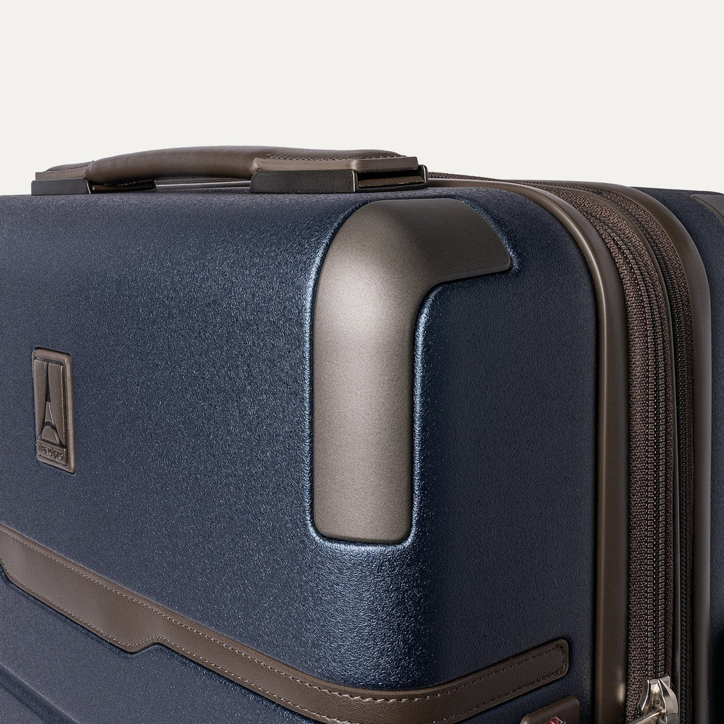 Close-up of the zinc corner armour on the Travelpro Platinum Reserve Compact Carry-On Hardside Spinner in Midnight Trail