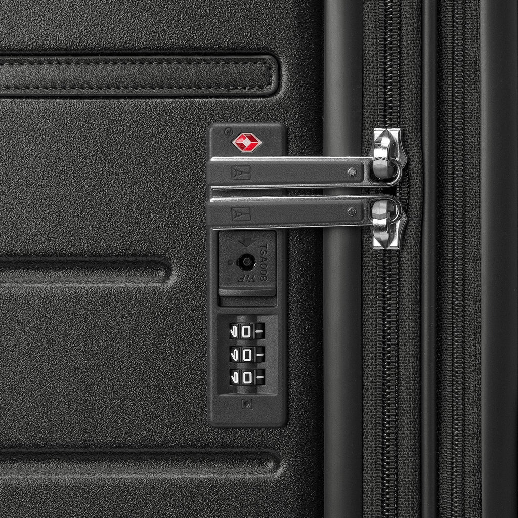 Close-up of the built-in TSA lock on the Travelpro Platinum Reserve Medium Check-In Hardside Spinner in Black Dust