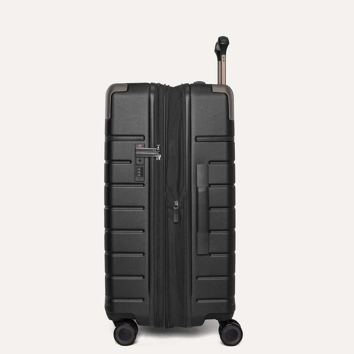 Side profile of the Travelpro Platinum Reserve Medium Check-In Hardside Spinner in Black Dust, expanded for extra packing space