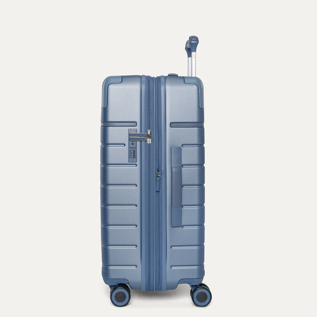 Side profile of the Travelpro Platinum Reserve Medium Check-In Hardside Spinner in Steel Blue
