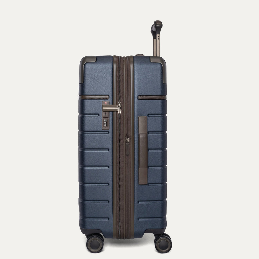 Side profile of the Travelpro Platinum Reserve Medium Check-In Hardside Spinner in Midnight Trail