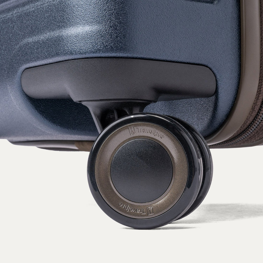 Close-up of a MagnaTrac self-aligning spinner wheel on the Travelpro Platinum Reserve Medium Check-In Hardside Spinner in Midnight Trail