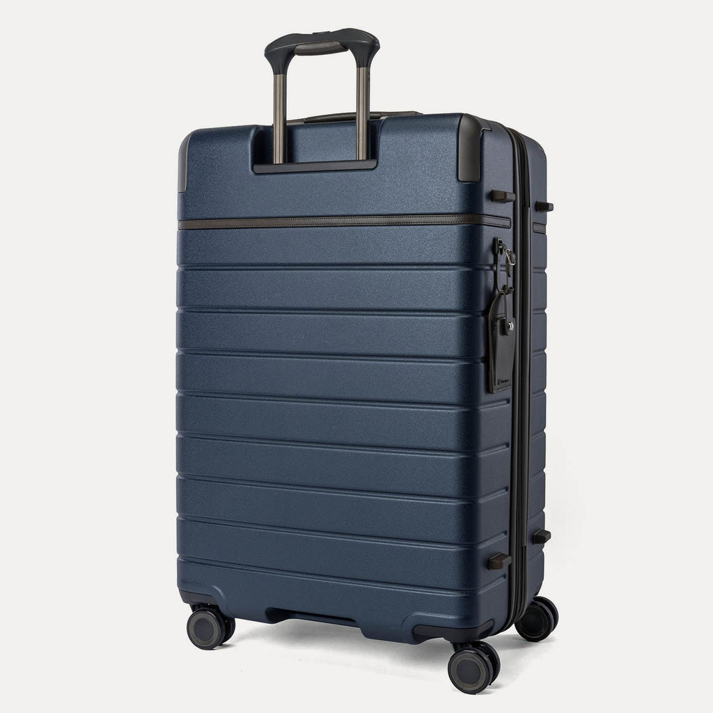 Rear angled view of the Travelpro Platinum Reserve Large Check-In Hardside Spinner in Midnight Trail
