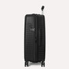 Valise noire à roulettes et poignée sur fond gris clair