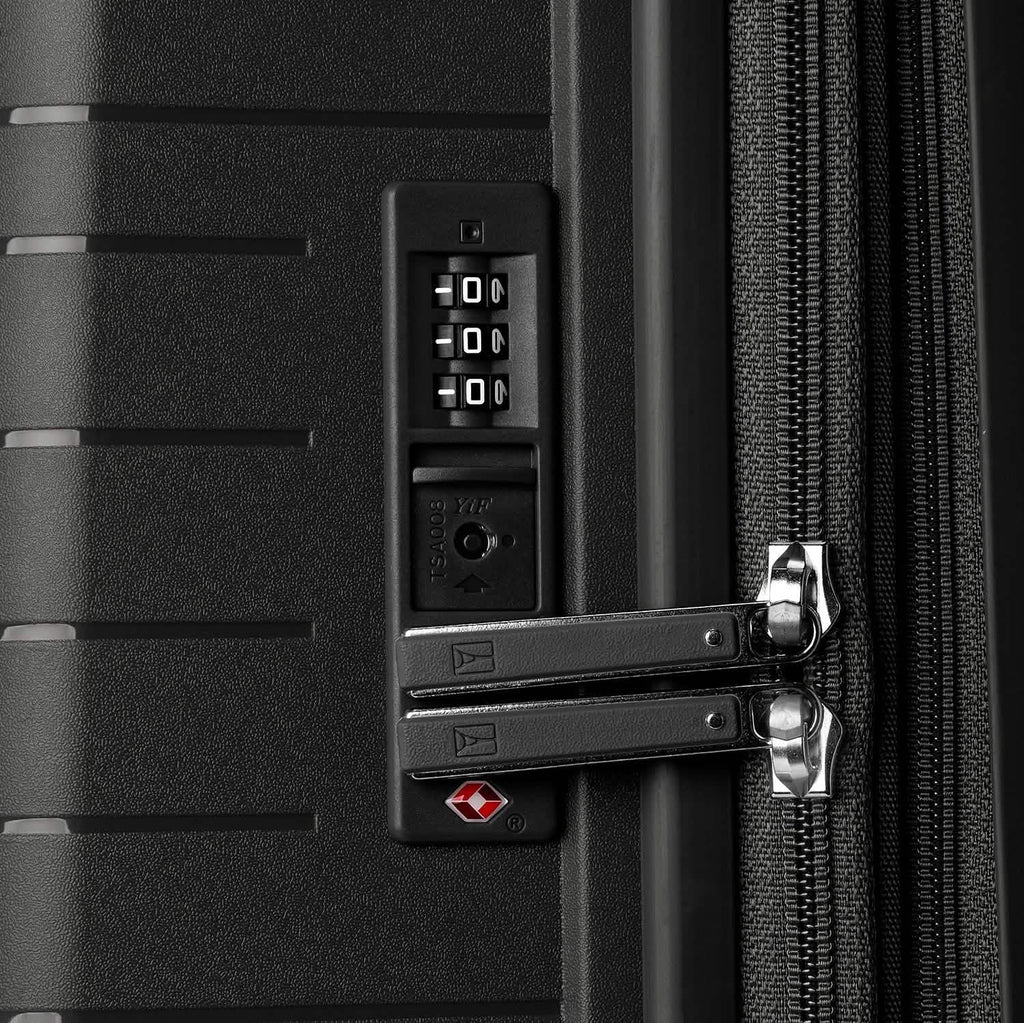#color_black Close-up of a black suitcase with a combination lock and TSA lock.