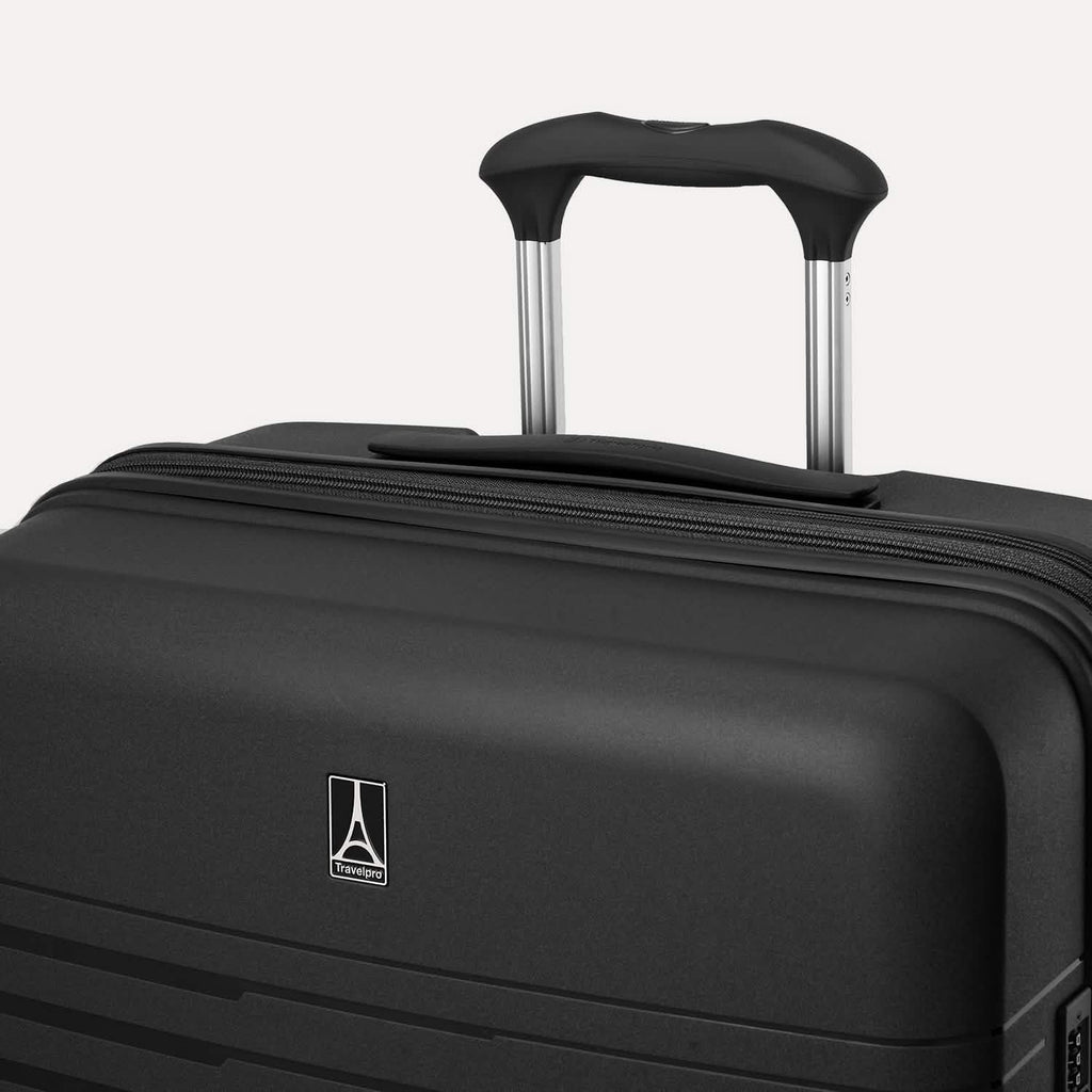 Black suitcase with a visible brand logo on a light gray background #color_black