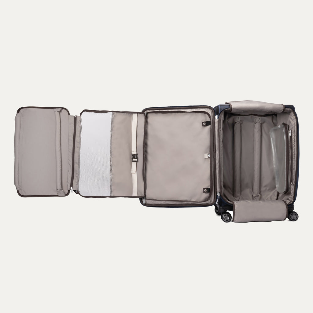 Expanded interior view of the Travelpro Platinum Elite Carry-On Spinner in Camouflage, showcasing full organizational compartments and a removable toiletry bag.
