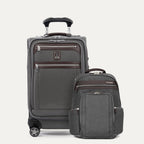 A set of travel luggage consisting of a carry-on spinner suitcase and a business backpack, both in grey color with premium fabrics and leather accents.
