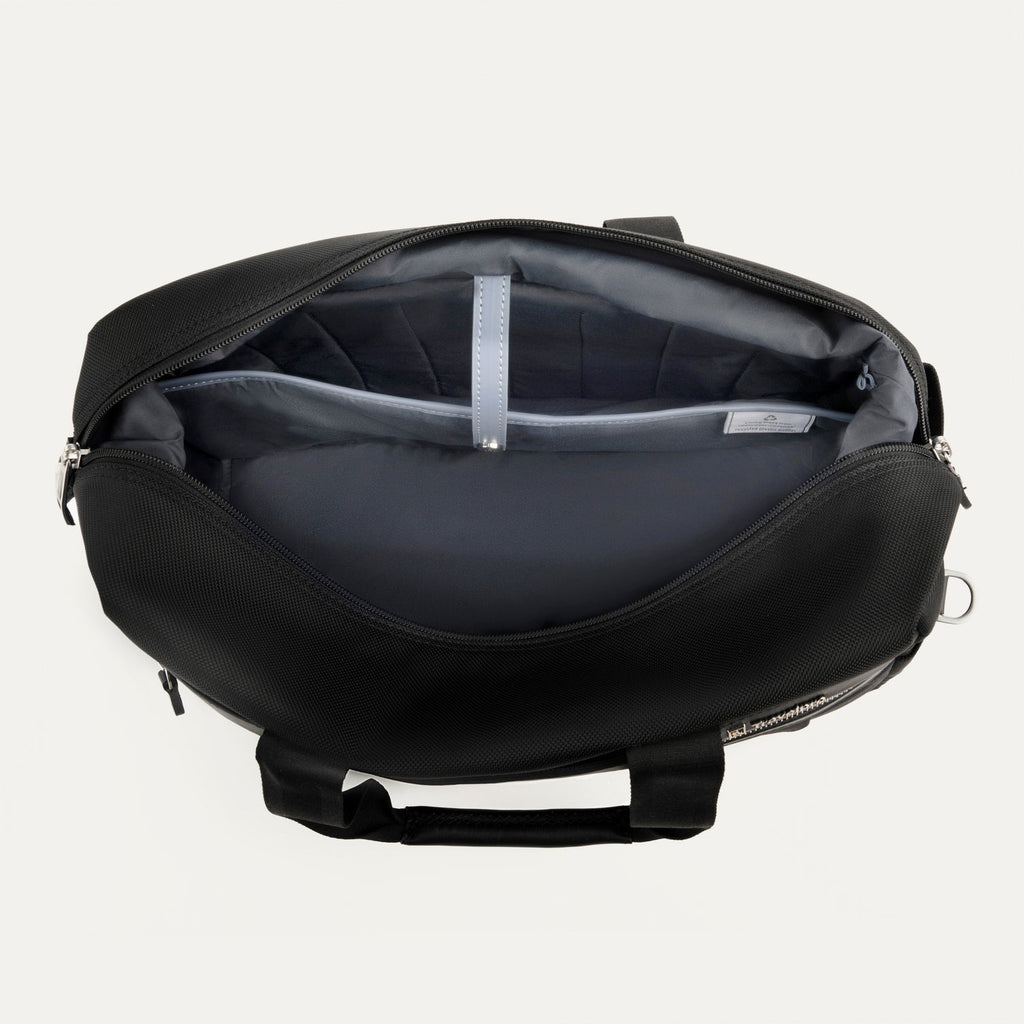 Open black tote interior view on a white background