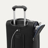 Close-up of black suitcase with extended handle and visible USB charging cable, on white background