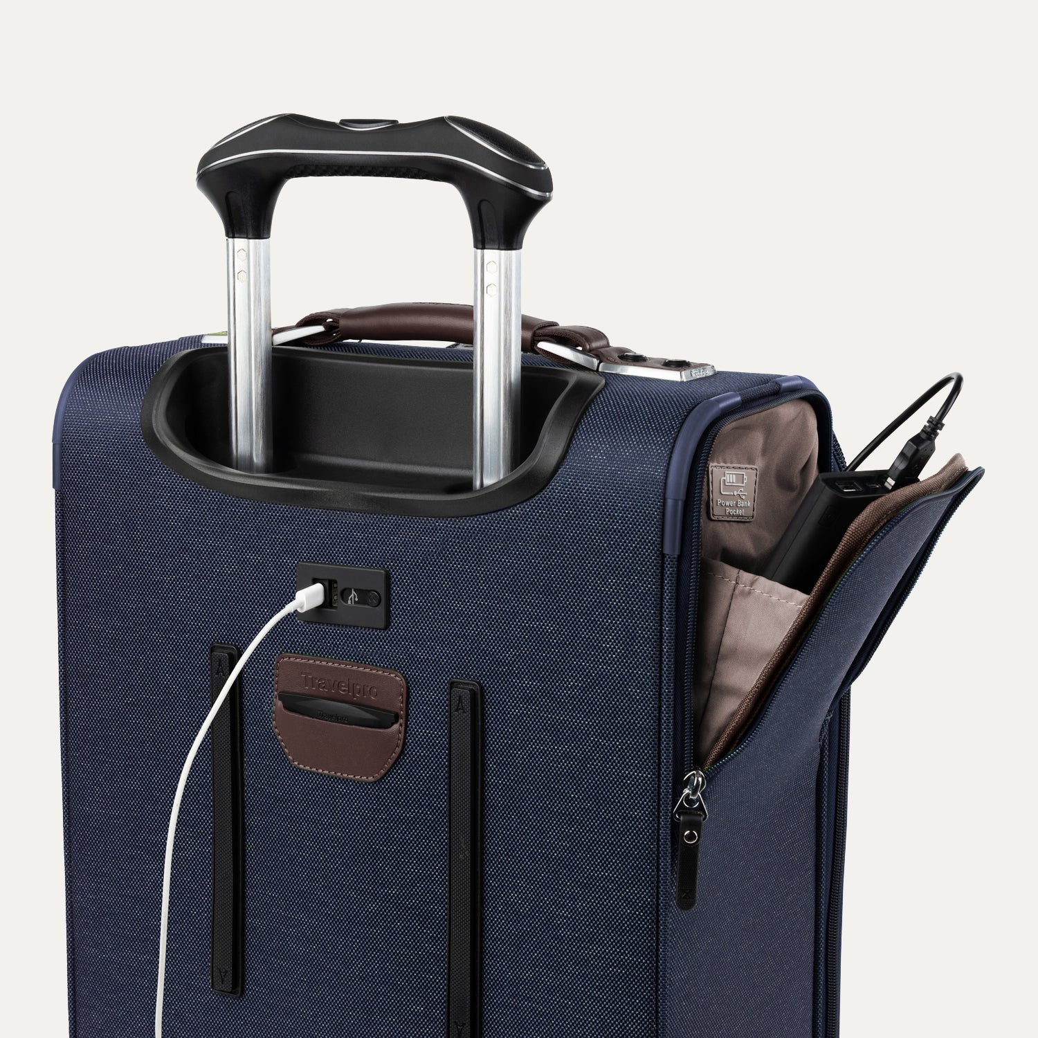 Close-up of blue suitcase with extended handle and visible USB charging cable, on white background