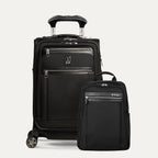 A set of black travel luggage, featuring a carry-on spinner suitcase and a slim backpack, both with the travelpro brand logo.