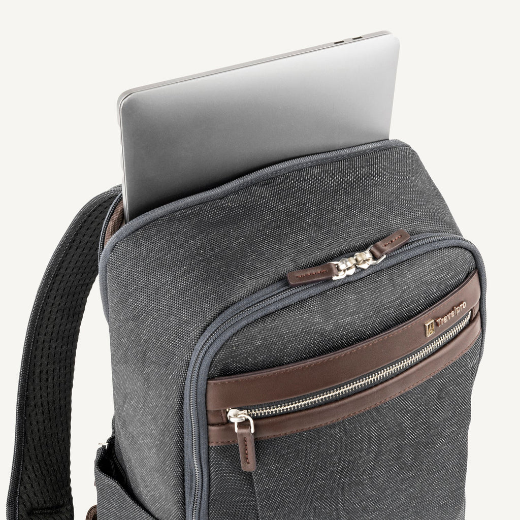 Vintage Gray backpack with laptop visibly stored in the dedicated sleeve compartment.
