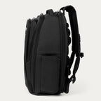Side view of black backpack on a white background