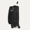 Side view of black suitcase with handle and wheels on a white a background 