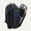 Aviator navy backpack with open compartments, displaying laptop and tablet in their designated sleeves on a white background.